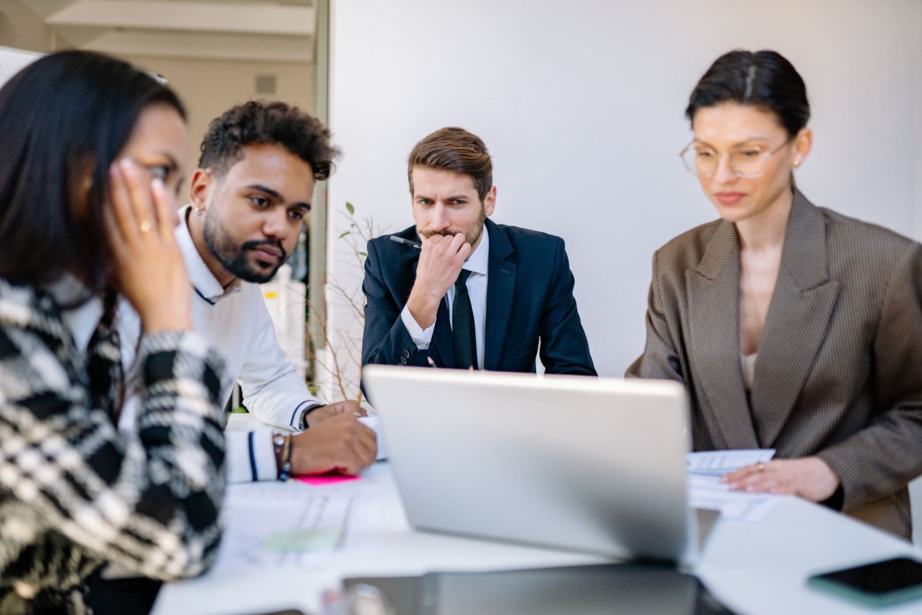 A product professional using analytics on a laptop in a modern workplace