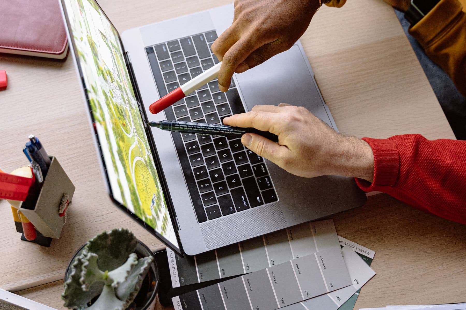 A product professional using analytics on a laptop in a modern workplace