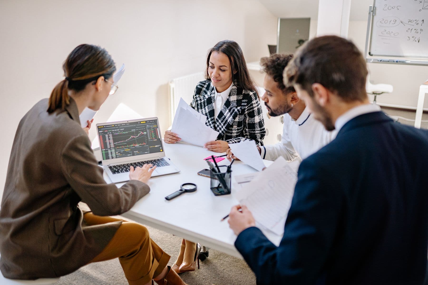 A product professional using analytics on a laptop in a modern workplace