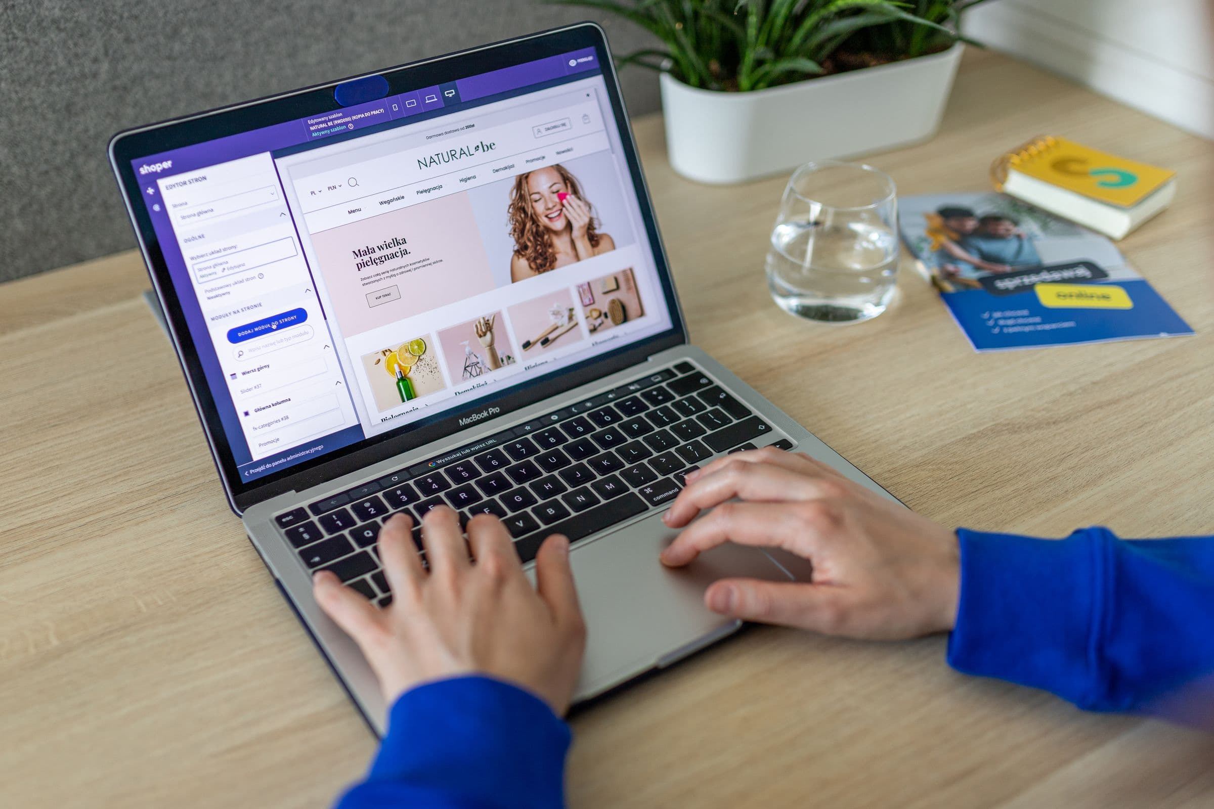 Online store owner editing a product storefront on a laptop.